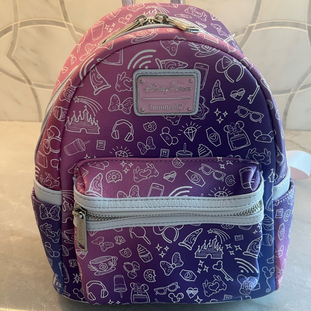 Loungefly Pink and Disney Purple Mini Backpack Whimsical Design